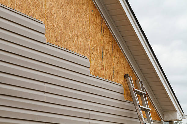 Professional Storm Damage Siding Repair technician working in Tuscarawas, OH